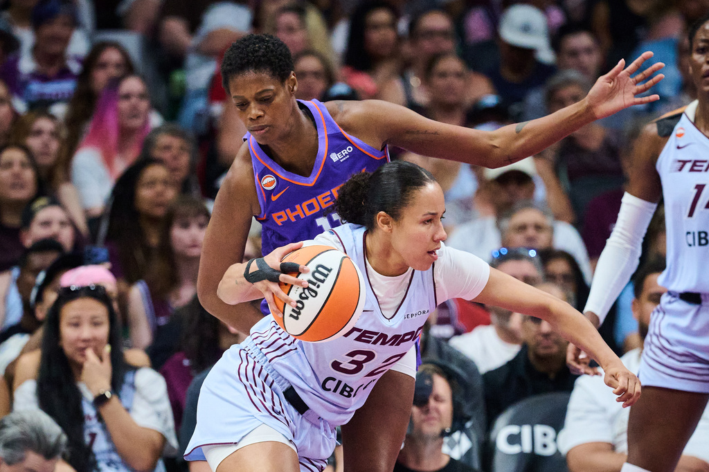Toronto Tempo's Tima Pouye (32) drives past Phoenix Mercury's Valeriane Ayayi (11) during first half of an WNBA basketball game in Toronto, on Saturday, June 27, 2026. (Sammy Kogan /The Canadian Press via AP)