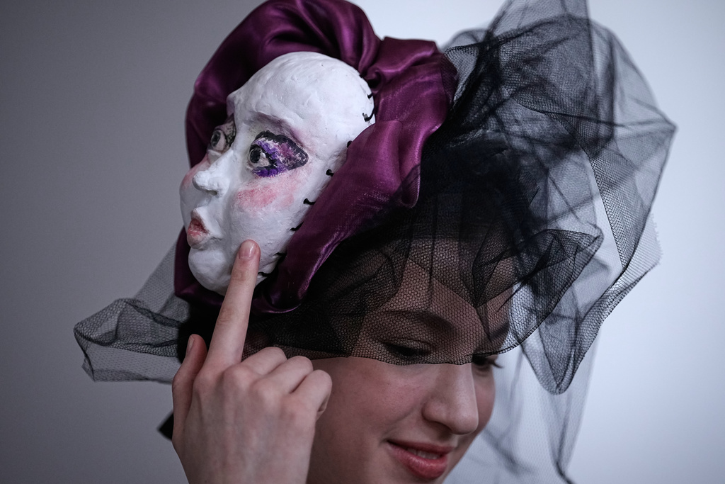A model wears a creation by students of the Russian Institute of Business and Design B&D prepares herself on backstage at the Moscow Fashion Week in Moscow, on Thursday, March 19, 2026. (AP Photo/Alexander Zemlianichenko)