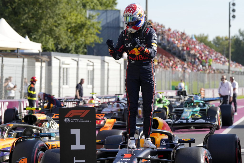 Red Bull driver Max Verstappen of the Netherlands celebrates his pole position after the qualifying session ahead of the Italian Grand Prix at the Monza racetrack in Monza, Italy, Saturday, Sept. 6, 2025. (AP Photo/Luca Bruno)