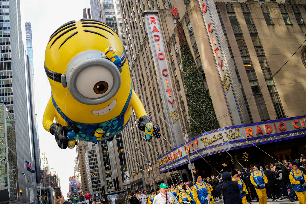 The Stuart the Minion balloon floats past Radio City Music Hall during the Macy's Thanksgiving Day Parade, Thursday, Nov. 27, 2025, in New York. (AP Photo/Eduardo Munoz Alvarez)