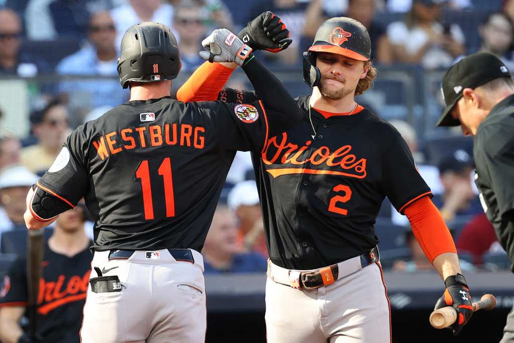 Baltimore Orioles' Jordan Westburg, left, and Gunnar Henderson, right, react after Westburg hit a home run during the fourth inning of a baseball game against the New York Yankees, Sunday, Sept. 28, 2025, in New York. (AP Photo/Pamela Smith)