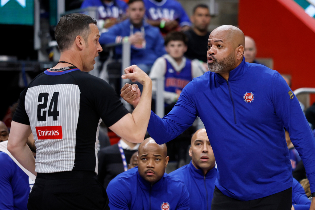 Detroit Pistons head coach J.B. Bickerstaff, right, argues with referee Kevin Scott (24) during the first half in Game 1 against the Orlando Magic in a first-round NBA basketball playoffs series Sunday, April 19, 2026, in Detroit. (AP Photo/Duane Burleson)