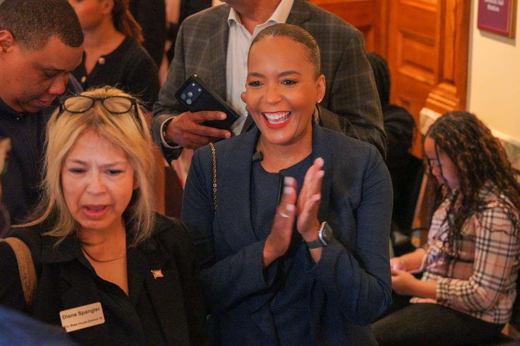 Former Atlanta Mayor Keisha Lance Bottoms smiles while waiting in line to file paperwork to qualify for the 2026 Georgia governor's race at the Georgia State Capitol, Monday, March 2, 2026, in Atlanta. (Matthew Pearson/WABE via AP)