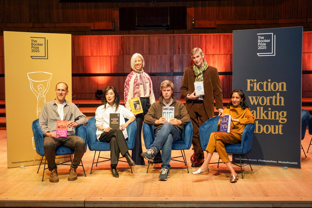The 6 shortlisted authors pose for photographs during a photocall for the Booker Prize, in London, Sunday, Nov. 9, 2025. (AP Photo/Alberto Pezzali)