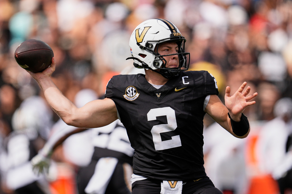 Vanderbilt quarterback Diego Pavia (2) looks to throw a pass during the first half of an NCAA college football game against Utah State, Saturday, Sept. 27, 2025, in Nashville, Tenn. (AP Photo/George Walker IV)