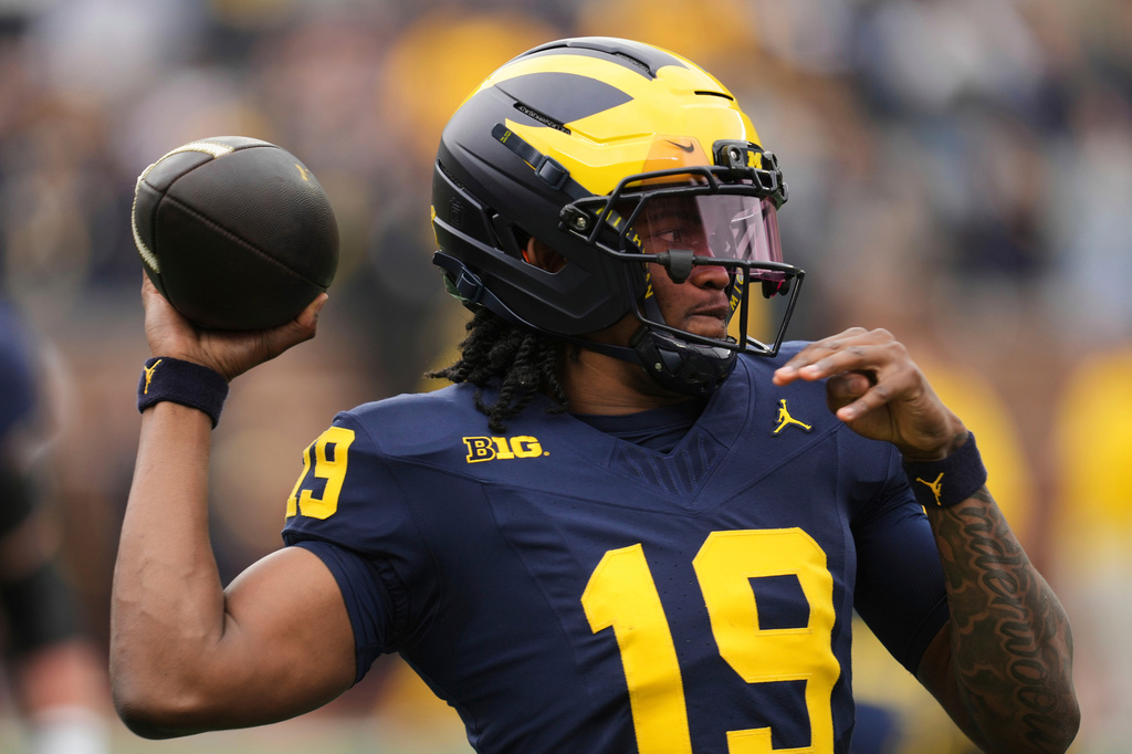 FILE - Michigan quarterback Bryce Underwood throws during an NCAA college football spring game in Ann Arbor, Mich., April 19, 2025. (AP Photo/Paul Sancya, File)