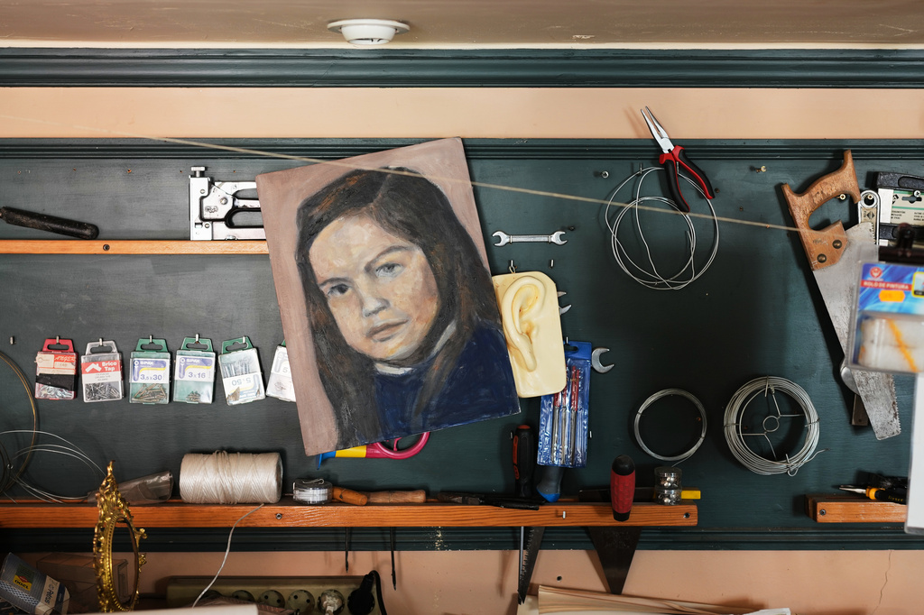 A childhood self-portrait by Paula Alonso-Pimentel hangs in the studio of her apartment in Madrid, Spain, Thursday, May 21, 2026. (AP Photo/Bernat Armangue)