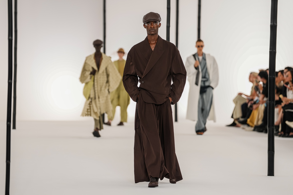 Models wear creations as part of the Issey Miyake Homme Spring Summer 2027 collection presented in Paris, France, Thursday, June 25, 2026. (AP Photo/Aurelien Morissard)