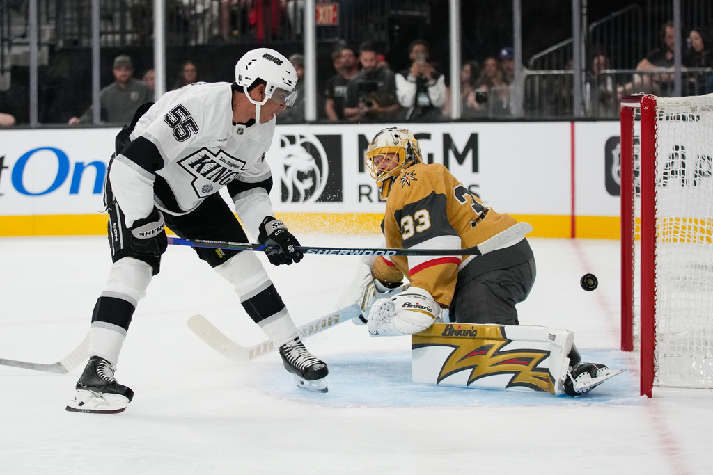 Los Angeles Kings right wing Quinton Byfield (55) scores against Vegas Golden Knights goaltender Adin Hill (33) during the first period of an NHL hockey game Wednesday, Oct. 8, 2025, in Las Vegas. (AP Photo/John Locher)
