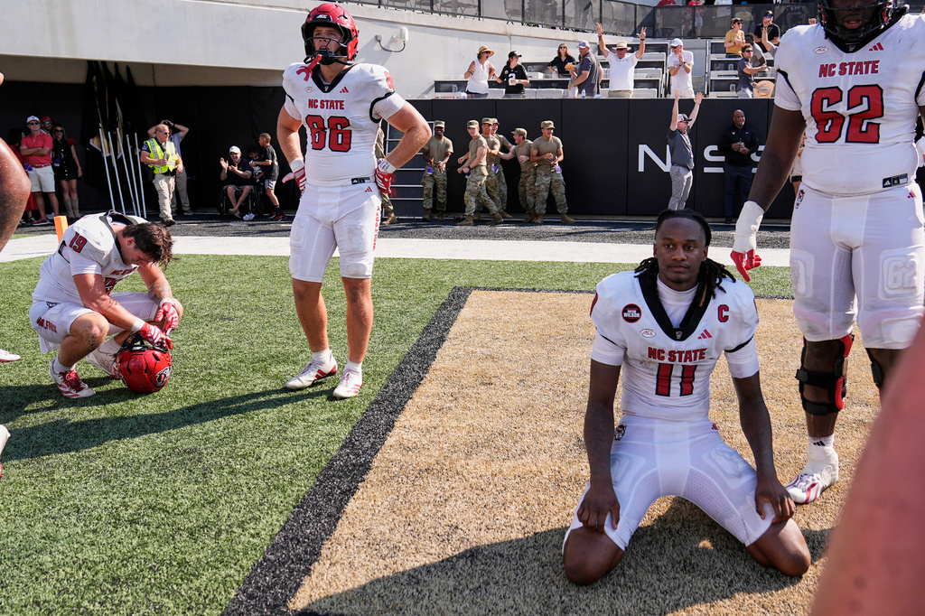 North Carolina State quarterback CJ Bailey (11) reacts after turning the ball over and allowing Vanderbilt to score a touchdown late in the second half of an NCAA college football game Saturday, Sept. 19, 2026, in Nashville, Tenn. (AP Photo/George Walker IV)
