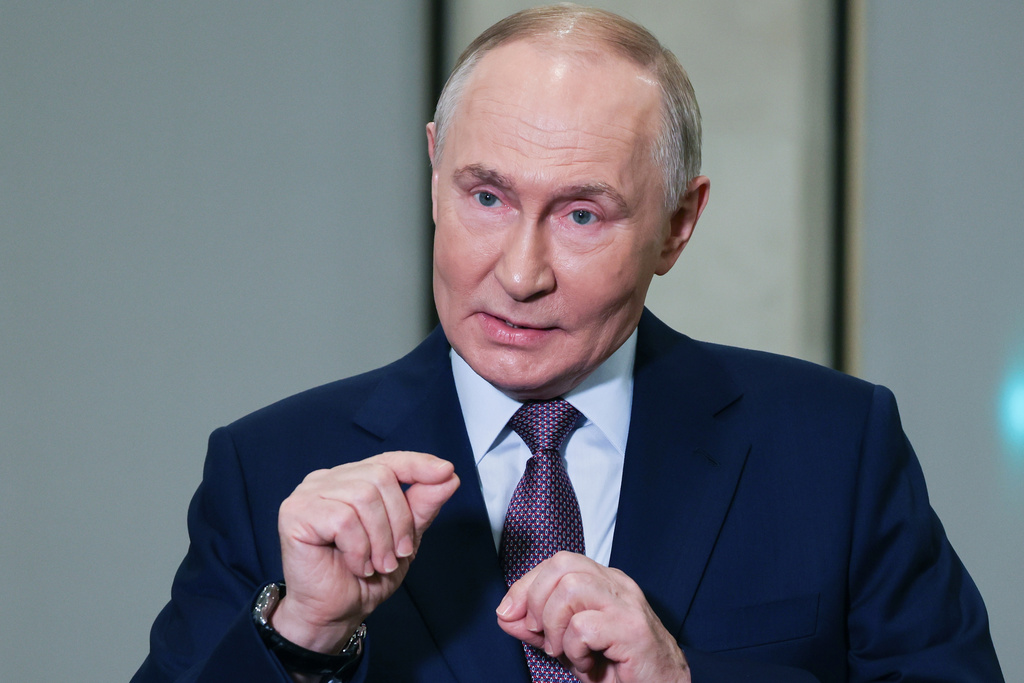 Russian President Vladimir Putin gestures while speaking to journalists on the sidelines of the Russian Geographical Society congress at the State Kremlin Palace in Moscow, Russia, Thursday, Oct. 23, 2025. (Vyacheslav Prokofyev, Sputnik, Kremlin Pool Photo via AP)