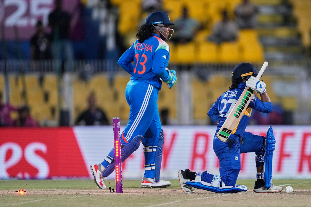 Sri Lanka's Nilakshi de Silva bowled out by India's Sneh Rana during the ICC Women's Cricket World Cup match between India and Sri Lanka at Barsapara Cricket Stadium in Guwahati, India, Tuesday, Sept. 30, 2025. (AP Photo/Anupam Nath)