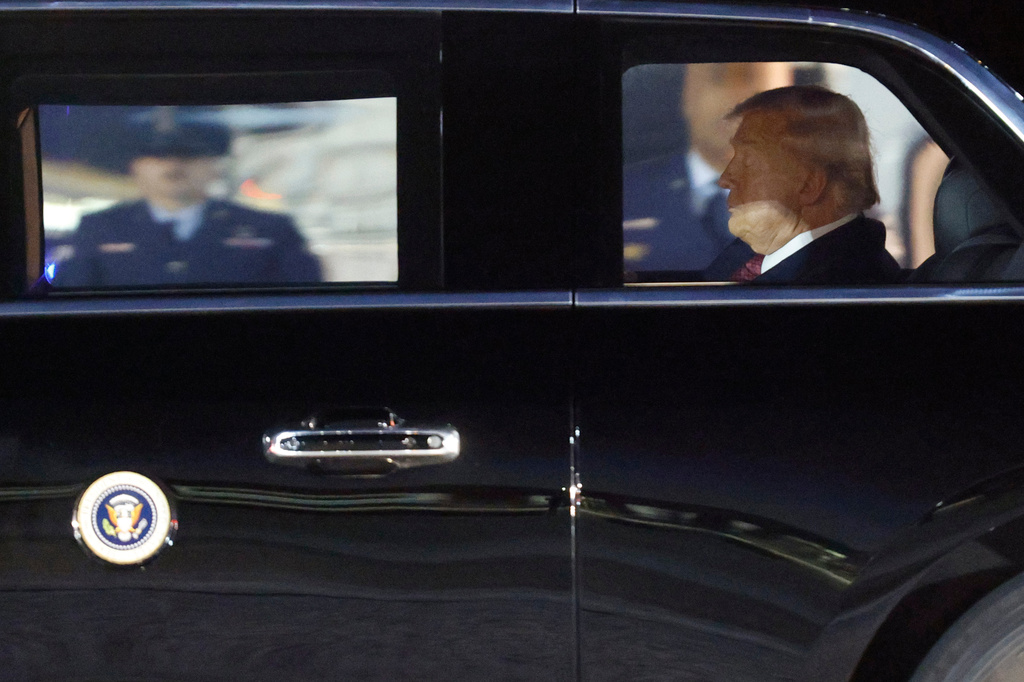 President Donald Trump is seen in his limousine, known as "The Beast," upon his arrival at Joint Base Andrews, Md., Wednesday, Nov. 5, 2025, after giving a speech at the American Business Forum in Miami. (AP Photo/Luis M. Alvarez)