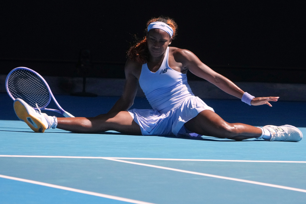 Coco Gauff of the U.S. falls during her second round match against Olga Danilovic of Serbia at the Australian Open tennis championship in Melbourne, Australia, Wednesday, Jan. 21, 2026. (AP Photo/Asanka Brendon Ratnayake)