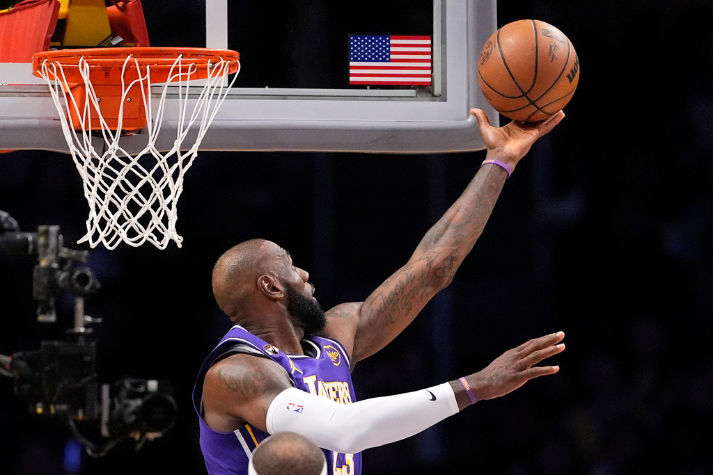 Los Angeles Lakers forward LeBron James shoots during the first half of an NBA basketball game against the Dallas Mavericks, Thursday, Feb. 12, 2026, in Los Angeles. (AP Photo/Mark J. Terrill)