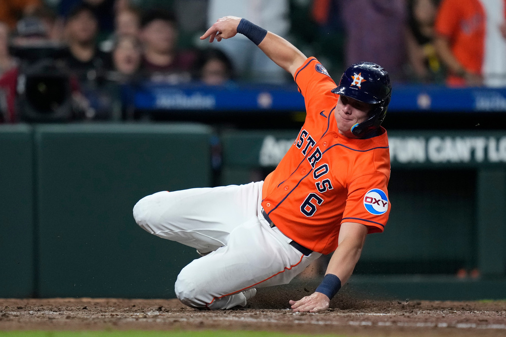 Houston Astros' Jake Meyers scores on a hit by Jeremy Peña during the eighth inning of a baseball game against the Cleveland Guardians, Friday, June 19, 2026, in Houston. (AP Photo/Kevin M. Cox)
