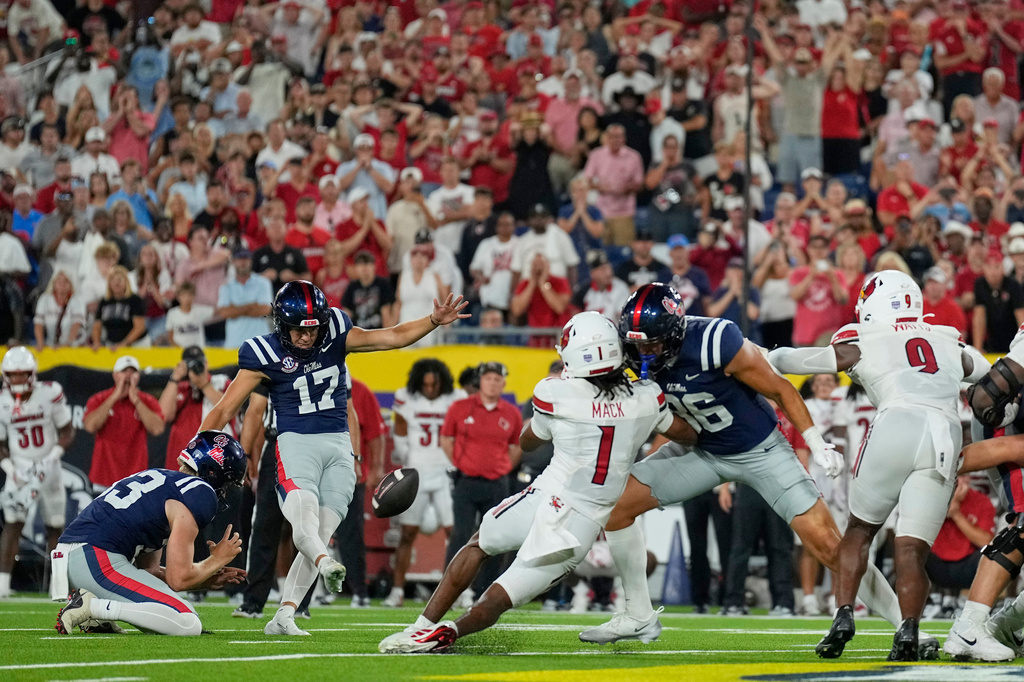 Mississippi kicker Lucas Carneiro (17) kicks the game winning field goal during the second half of an NCAA college football game against Louisville, Sunday, Sept. 6, 2026, in Nashville, Tenn. (AP Photo/George Walker IV)
