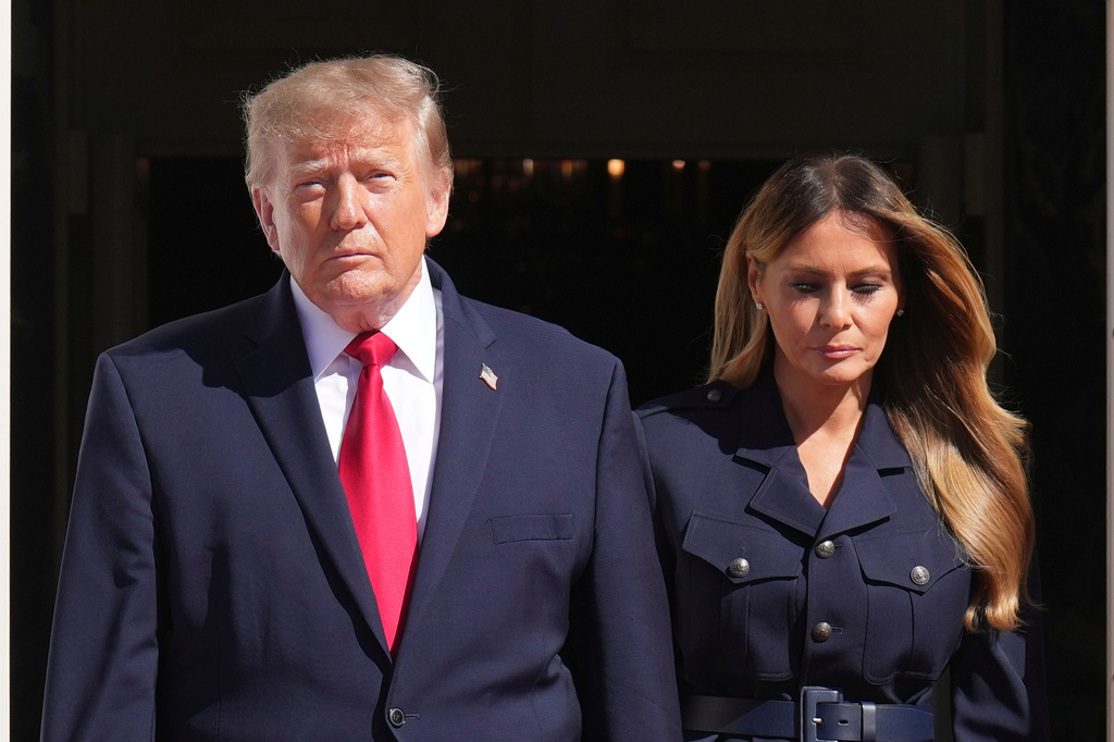 President Donald Trump, left, and first lady Melania Trump walk to greet China's President Xi Jinping and his wife Peng Liyuan as they arrive at the South Portico of the White House for tea, Friday, Sept. 25, 2026, in Washington. (AP Photo/Jacquelyn Martin)