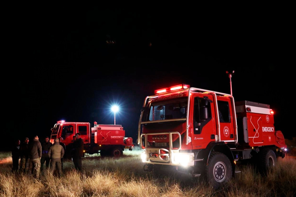This photo released by Georgian Interior Ministry Press Service shows an emergency vehicle on a crash site of Turkish C-130 military cargo near the border between Georgia and Azerbaijan on Tuesday, Nov. 11, 2025. (Georgian Interior Ministry Press Service via AP)