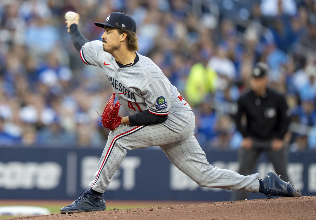 Minnesota Twins starting pitcher Joe Ryan throws in first-inning baseball game action against the Toronto Blue Jays in Toronto, Monday, Aug. 25, 2025. (Frank Gunn/The Canadian Press via AP)