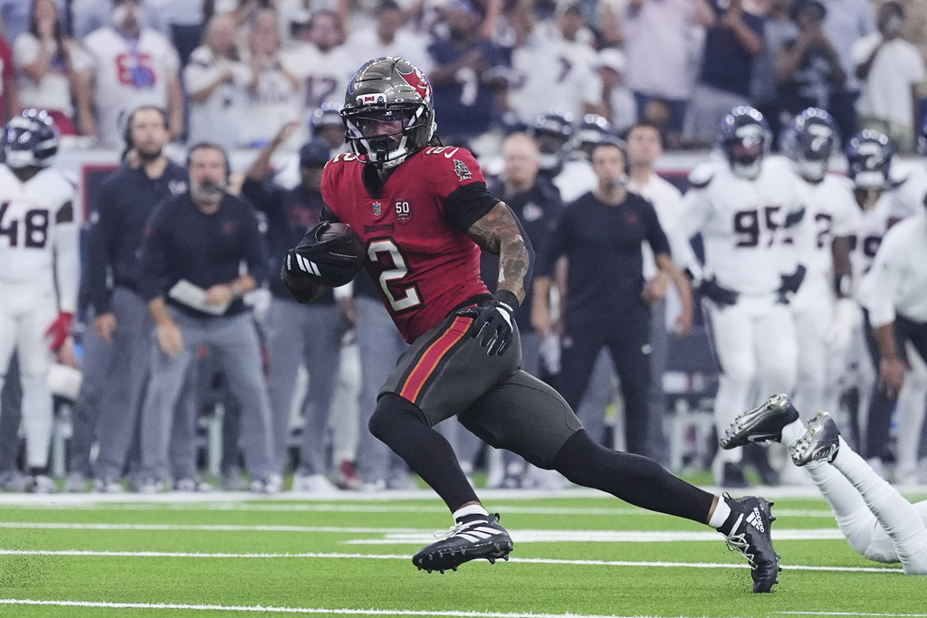 Tampa Bay Buccaneers wide receiver Emeka Egbuka (2) springs to the end zone to score a touchdown in the first half of an NFL football game against the Houston Texans Monday, Sept. 15, 2025, in Houston, Texas. (AP Photo/Eric Gay)