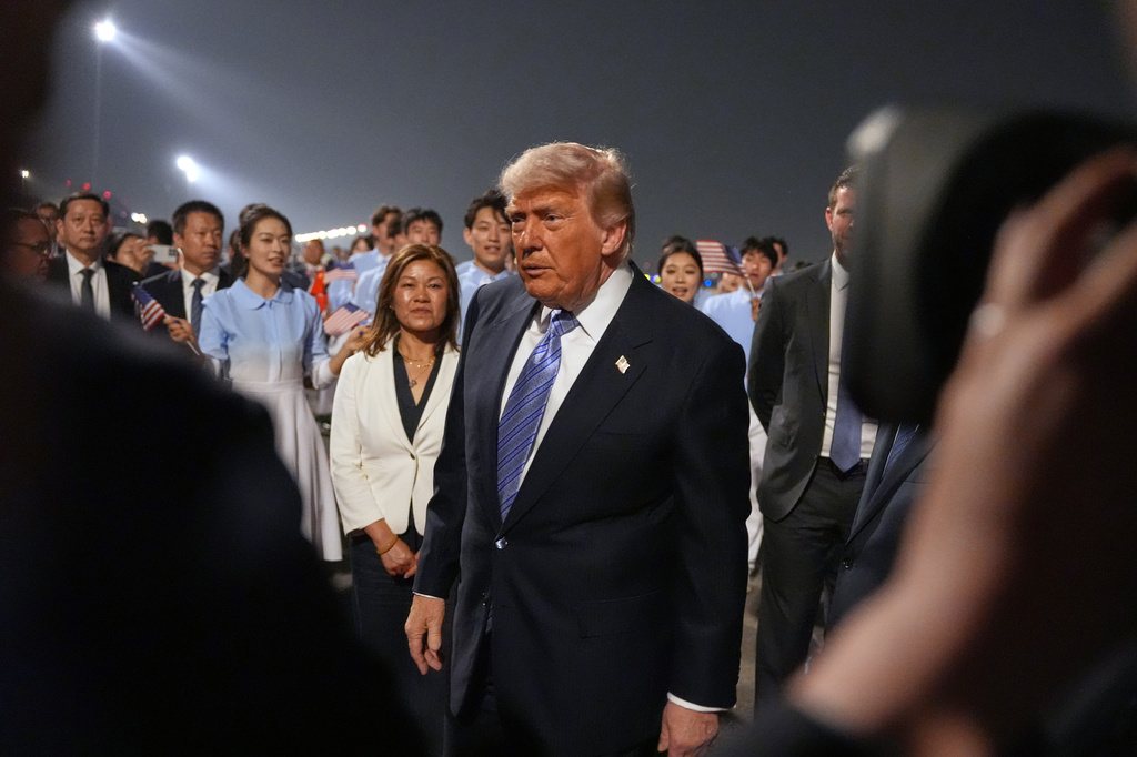 President Donald Trump walks during a welcome ceremony as he arrives on Air Force One, Wednesday, May 13, 2026, at Beijing Capital International Airport in Beijing. (AP Photo/Mark Schiefelbein)