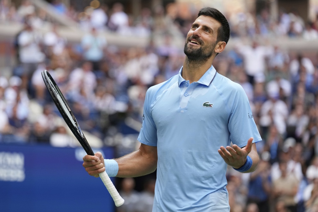 Novak Djokovic, of Serbia, getstures against Carlos Alcaraz, of Spain, during the men's singles semifinals of the U.S. Open tennis championships, Friday, Sept. 5, 2025, in New York. (AP Photo/Seth Wenig)
