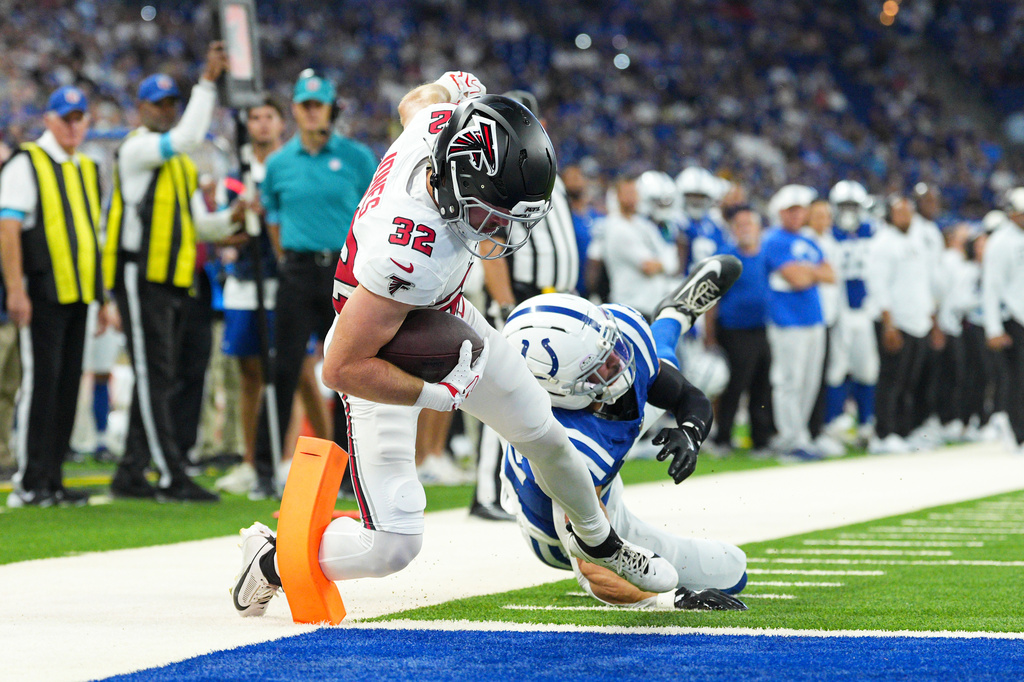 Atlanta Falcons running back Cash Jones (32) gets past Indianapolis Colts safety Daniel Scott (32) for a touchdown during the first half of an NFL football game in Indianapolis, Saturday, Aug. 22, 2026. (AP Photo/AJ Mast)