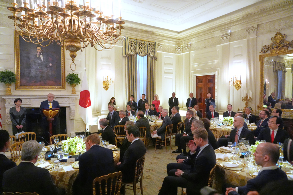President Donald Trump attends a dinner with Japan's Prime Minister Sanae Takaichi in the State Dining Room of the White House, Thursday, March 19, 2026, in Washington. (AP Photo/Julia Demaree Nikhinson)