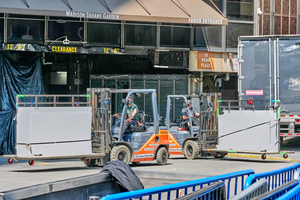 Fork lifts work outside New York's Madison Square Garden, Wednesday, July 1, 2026. (AP Photo/Richard Drew)