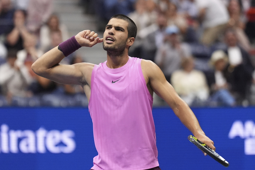 Carlos Alcaraz, of Spain, reacts during the men's singles final of the U.S. Open tennis championships against Jannik Sinner, of Italy, Sunday, Sept. 7, 2025, in New York. (AP Photo/Frank Franklin II)