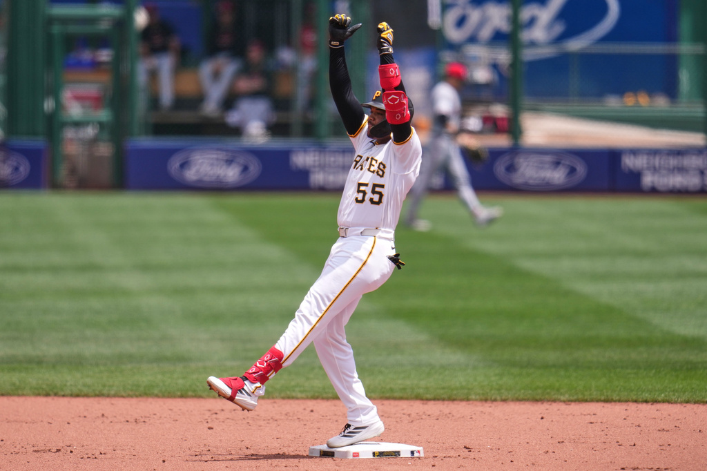 Pittsburgh Pirates' Esmerlyn Valdez celebrates as he stands on second base after hitting a double off Cincinnati Reds pitcher Brady Singer, driving in a run, during the second inning of a baseball game in Pittsburgh, Sunday, June 28, 2026. (AP Photo/Gene J. Puskar)