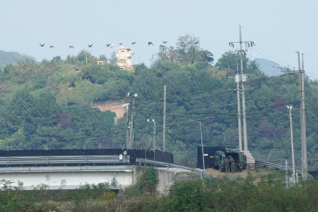 FILE - A North Korean military guard post, top, and South Korean army soldiers, bottom, are seen from Paju, South Korea, near the border with North Korea, on Oct. 10, 2024. (AP Photo/Ahn Young-joon, File)
