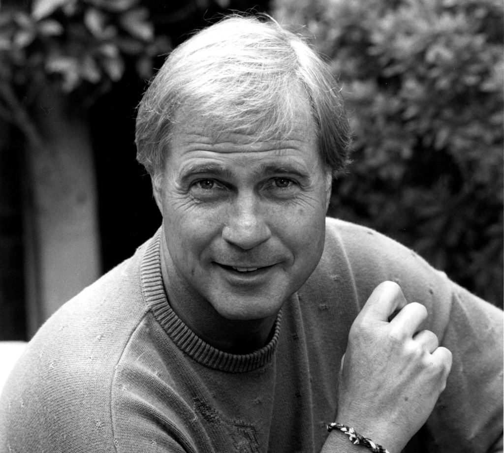 FILE - Actor Gil Gerard poses in Los Angeles, Ca. on July 16, 1990. (AP Photo/Reed Saxon, File)