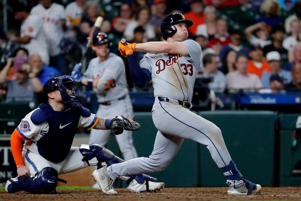 Detroit Tigers' Colt Keith (33) watches his second two-run home run of a baseball game in front of Houston Astros catcher Christian Vazquez, left, during the seventh inning Monday, June 15, 2026, in Houston. (AP Photo/Michael Wyke)