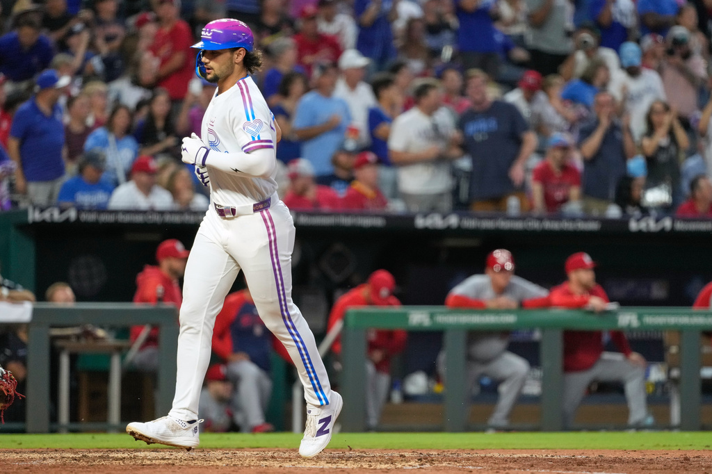 Kansas City Royals' Jac Caglianone crosses the plate to score after hitting a solo home run during the fifth inning of a baseball game against the St. Louis Cardinals, Friday, June 19, 2026, in Kansas City, Mo. (AP Photo/Charlie Riedel)