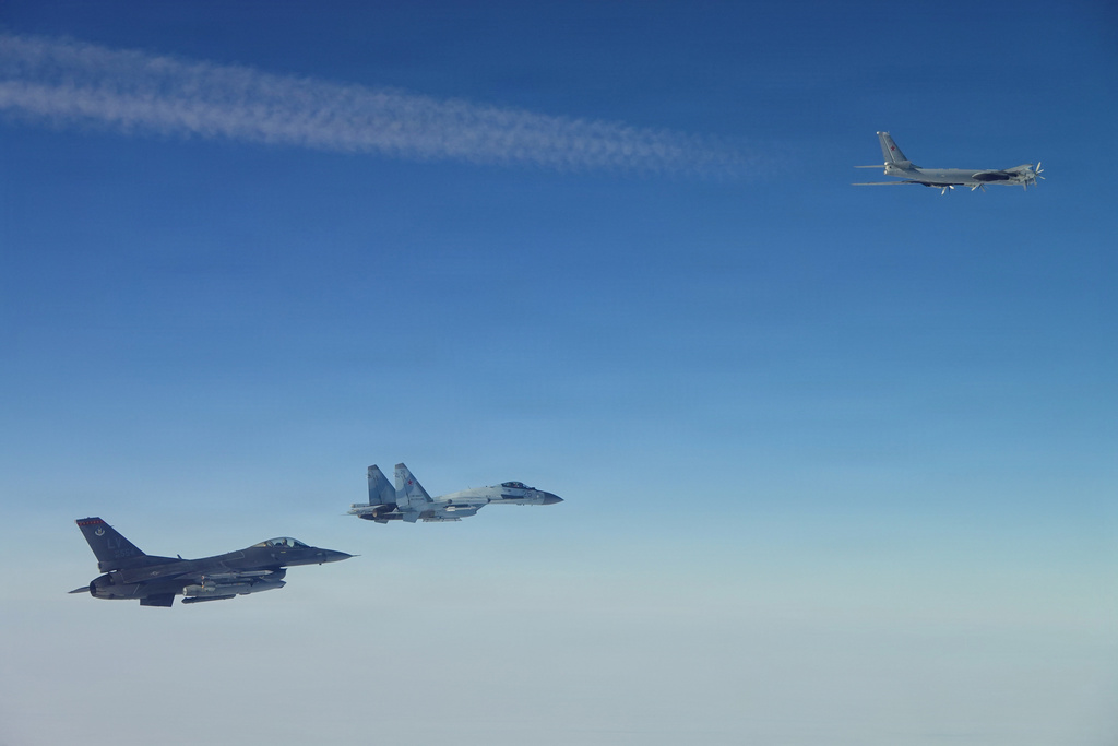 This photo provided by the U.S. Department of Defense shows a North American Aerospace Defense Command F-16 fighter aircraft intercepting Russian Tu-95 and Su-35 military aircraft near the Bering Strait, west of Alaska, on Thursday, Feb. 19, 2026. (Department of Defense photo via AP)