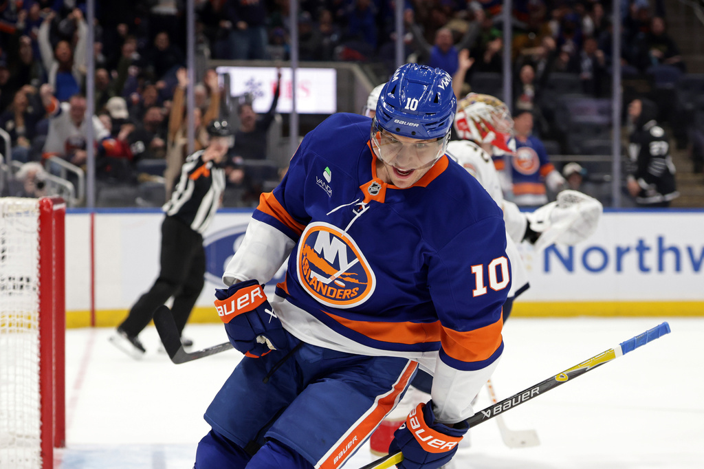 New York Islanders center Brayden Schenn (10) reacts after scoring a goal past Florida Panthers goaltender Daniil Tarasov in the second period of an NHL hockey game Saturday, March 28, 2026, in Elmont, N.Y. (AP Photo/Adam Hunger)