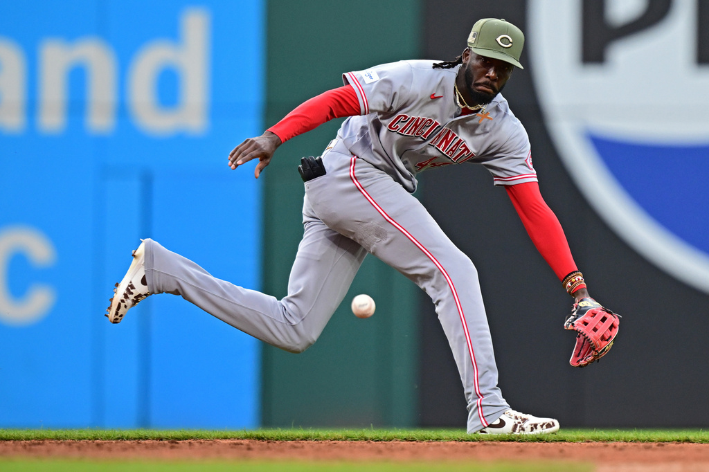 Cincinnati Reds shortstop Elly de la Cruz chases after a ball hit by Cleveland Guardians third baseman Jose Ramirez during the third inning of a baseball game, Friday, May 15, 2026, in Cleveland. (AP Photo/David Dermer)