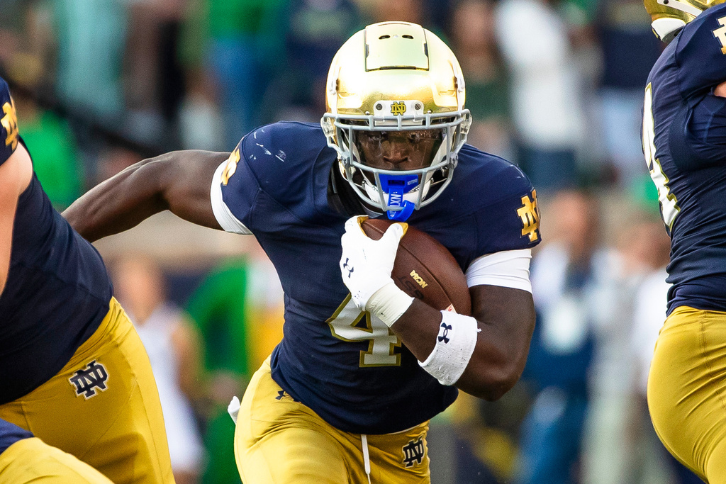 FILE - Notre Dame running back Jeremiyah Love (4) runs the ball during the second half of an NCAA college football game against Stanford, Saturday, Oct. 12, 2024, in South Bend, Ind. (AP Photo/Michael Caterina, File)