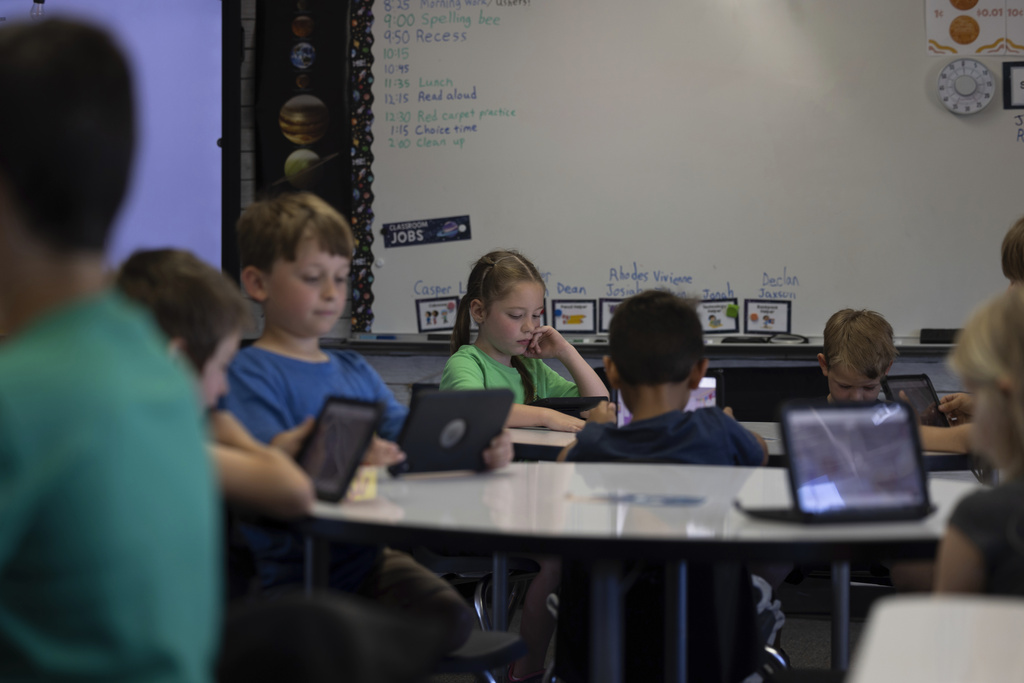 Students work on their tablets in a classroom at Achieve Academy School of Paradise in Paradise, Calif., May 21, 2025. (Miguel Gutierrez Jr./CalMatters via AP)