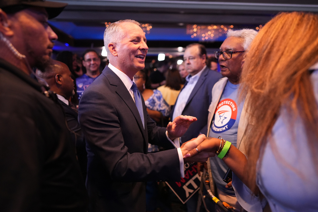 Florida Democratic gubernatorial candidate David Jolly shakes hands with supporters during a primary election night watch party, Tuesday, Aug. 18, 2026, in Miami Lakes, Fla. (AP Photo/Rebecca Blackwell)