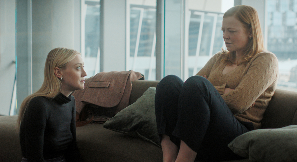 This image released by Peacock shows Dakota Fanning, left, and Sarah Snook in a scene from "All Her Fault." (Peacock via AP)