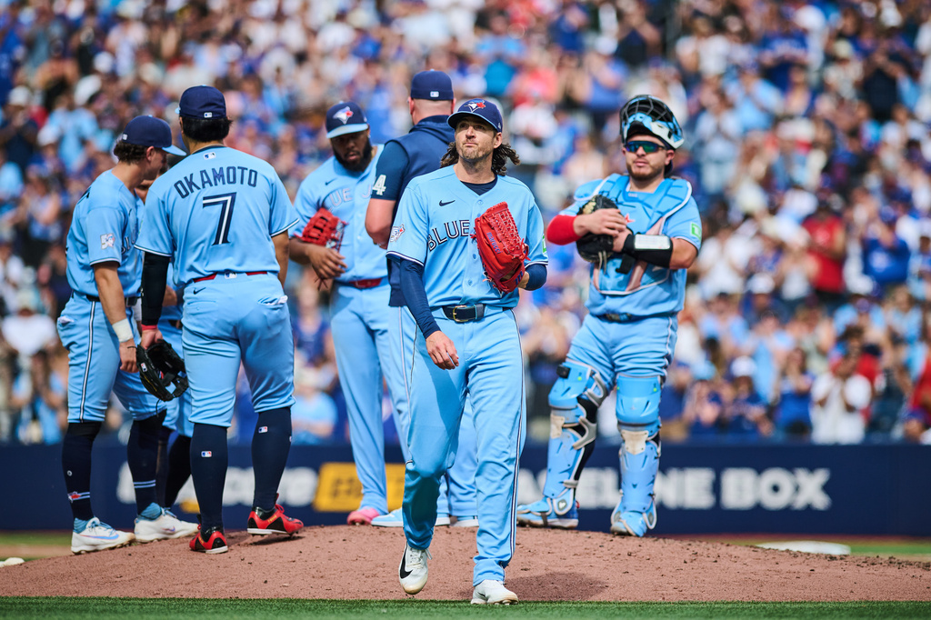 Toronto Blue Jays' Kevin Gausman (34) looks on as he is taken out of the game by manager John Schneider during sixth inning MLB baseball action against the St. Louis Cardinals in Toronto, on Saturday, Aug. 1, 2026. THE CANADIAN PRESS/Sammy Kogan/The Canadian Press via AP)