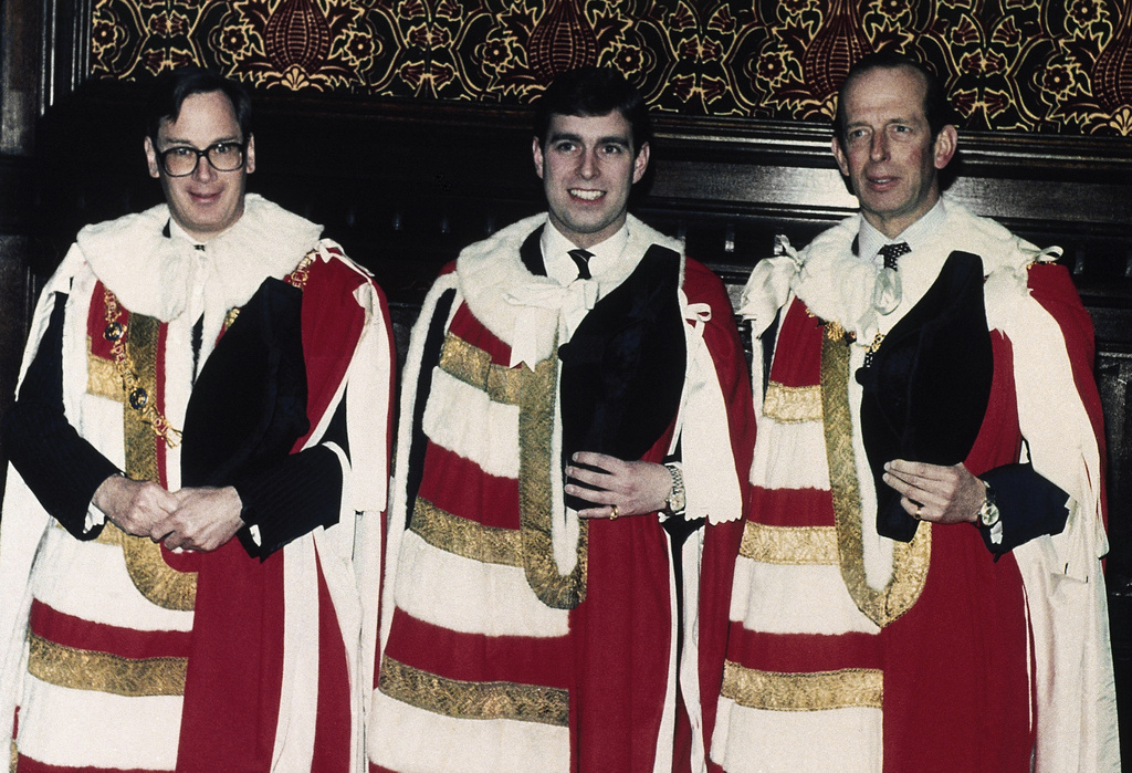 FILE - Flanked by the Prince Richard, Duke of Gloucester, left, and the Prince Edward, Duke of Kent, right, Prince Andrew, the Duke of York, shown in the Moses room at the House of Lords in London on Feb. 11, 1987. (AP Photo/John Redman, file)