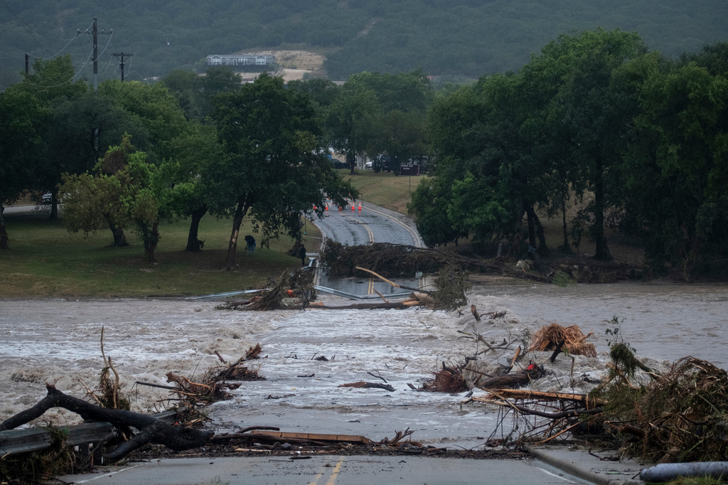 Flooding blocks off G Street along the Guadalupe River on Thursday, July 16, 2026, in Kerrville, Texas. (AP Photo/Joel Angel Juarez)