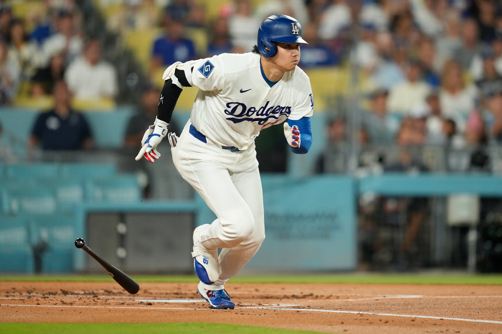 Los Angeles Dodgers' Shohei Ohtani heads to first for a single during the first inning of a baseball game against the San Diego Padres, Wednesday, Sept. 23, 2026, in Los Angeles. (AP Photo/Mark J. Terrill)