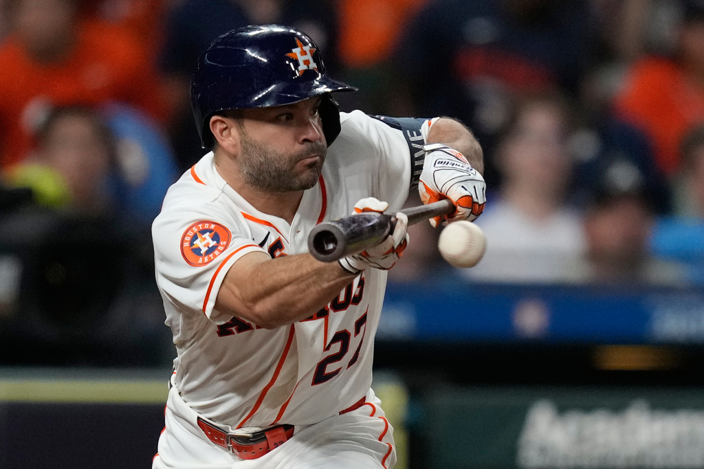 Houston Astros' Jose Altuve singles on a bunt during the eighth inning of a baseball game against the Atlanta Braves in Houston, Saturday, Sept. 19, 2026. (AP Photo/Ashley Landis)