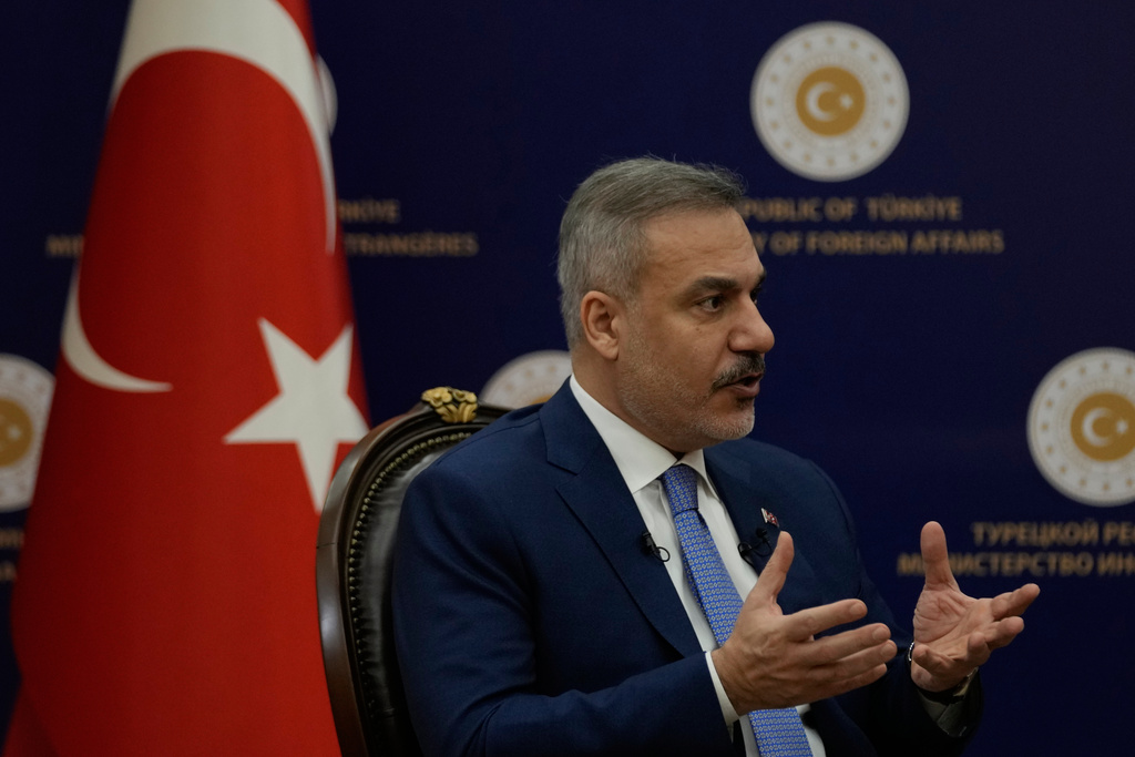 Turkey's Foreign Minister Hakan Fidan speaks during an interview with The Associated Press, in Ankara, Turkey, Saturday, March 14, 2026. (AP Photo/Khalil Hamra)