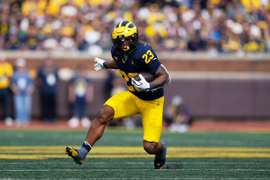 Michigan running back Jordan Marshall runs during the first half of an NCAA college football game against Washington, Saturday, Oct. 18, 2025, in Ann Arbor, Mich. (AP Photo/Ryan Sun)